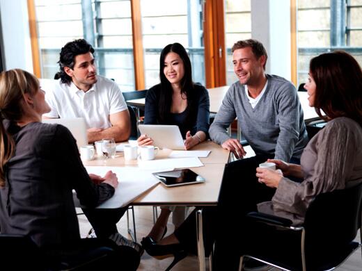 Participants discussing topics around a table in a focus group